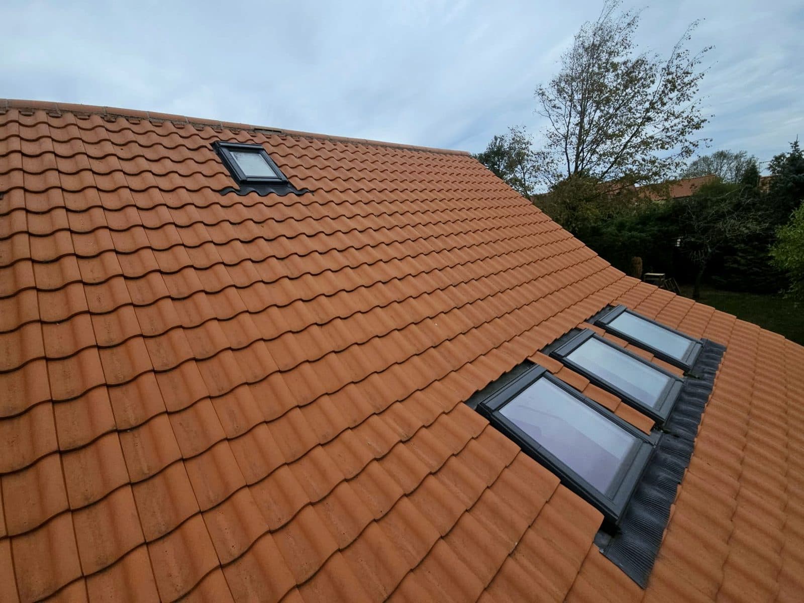 A new red pantile roof in Hoveringham with four rooflights fitted and flashed in