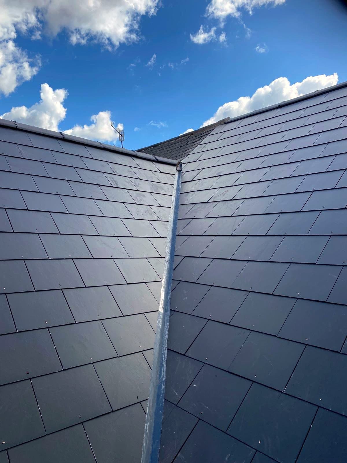 A new lead-lined valley between two natural slate roof slopes