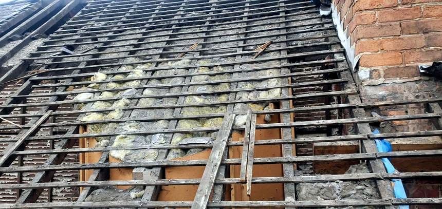 Old rotten roof timbers uncovered during a repair