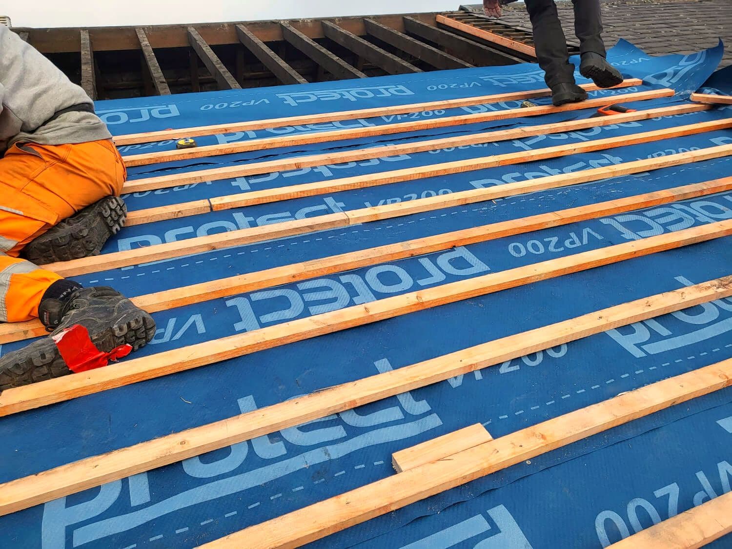 New breathable membrane and battens going on over the rafters