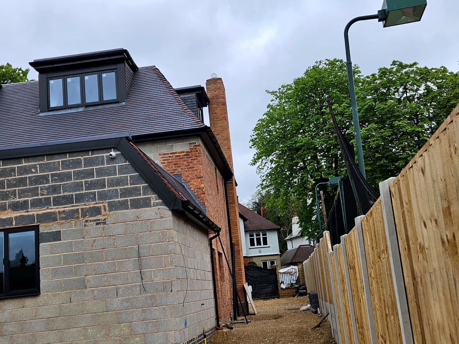 The side elevation of the new build showing the roof and dormers