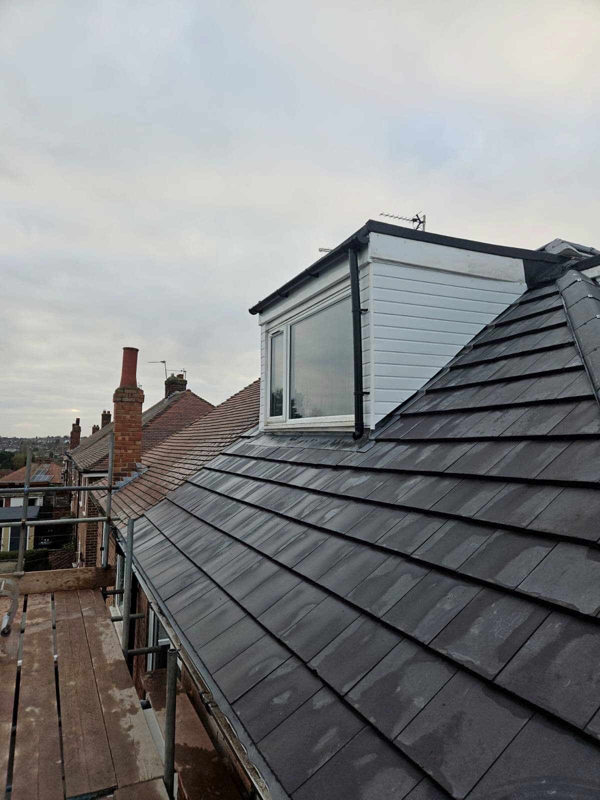 The slate roof and dormer seen from the side