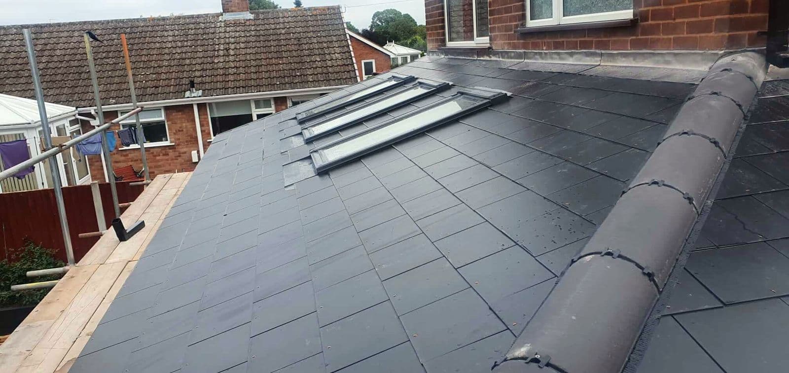 A slate roof with a Velux rooflight