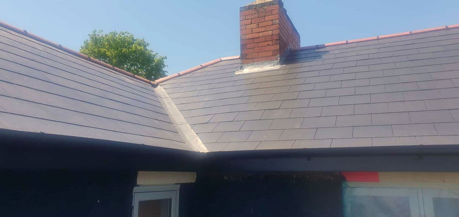 New white uPVC fascias and soffits under a grey tiled roof
